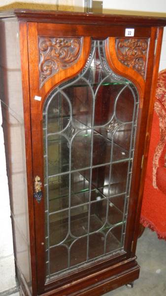 A lead glazed cabinet.