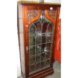 A lead glazed cabinet.