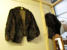 A fur jacket and a fur cape.