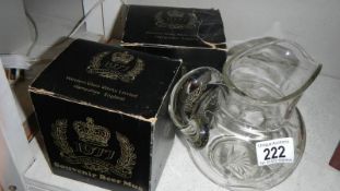 A good quality cut glass jugs and 2 boxed 1977 silver jubilee tankards.