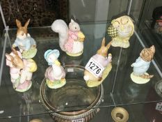 7 Beatrix Potter figurines.