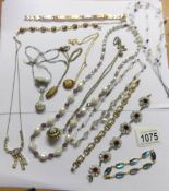 A mixed lot of necklaces, pendants and bracelets.