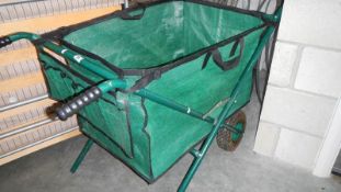 A folding garden barrow.