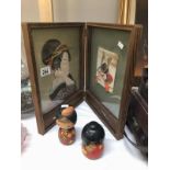 A Japanese double picture and 2 Japanese dolls.
