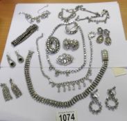 6 diamonte' necklaces, a bracelet, 4 brooches and 4 pairs of earrings.