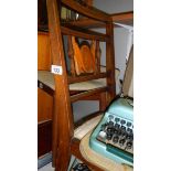 A pair of mahogany inlaid chairs.