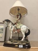 An American Indian chief on horseback as a table lamp.