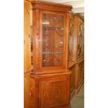 An oak corner cabinet.