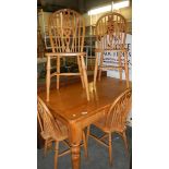 A pine table and 4 chairs.