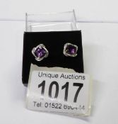 A pair of 9ct gold amethyst set earrings.