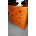 A 3 drawer satin walnut chest.