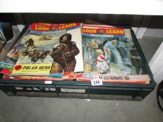 A box of Look and Learn magazines.
