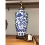 A blue and white pottery lamp base.