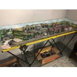 An 'N Gauge' railway layout including a box of Hornby Minitrix and Lima rolling stock and engines.