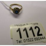 A gold ring set with diamonds and sapphire (no hall mark but tests as 18ct). Size N.