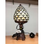 A table lamp with Tiffany style shade.