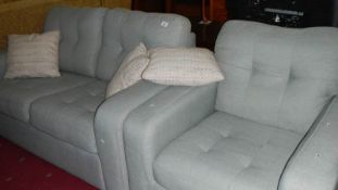 A 2 seat sofa and a chair.