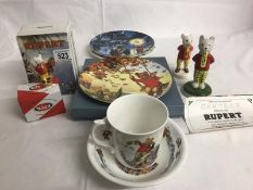 A collection of Rupert the bear figurines & pottery items including Beswick Rupert, wade Rupert,