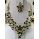 A superb green and white stone necklace with matching earrings.