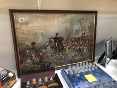 A framed and glazed battle scene.