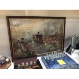 A framed and glazed battle scene.