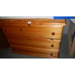 A pine 3 drawer chest.