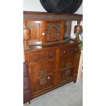 An oak court cupboard