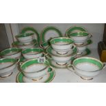 A quantity of Paragon soup bowls with saucers.