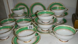 A quantity of Paragon soup bowls with saucers.