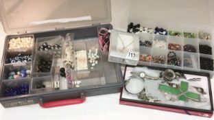 A mixed lot of costume jewellery, watches and loose beads etc.