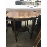 An oval inlaid occasional table.