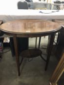 An oval inlaid occasional table.