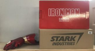 A boxed Iron Man wearable blaster gauntlet in Stark Industries outer box, by Cattoys CC.