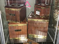 A set of 4 wooden storage canisters.