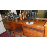 A teak dressing table with stool.