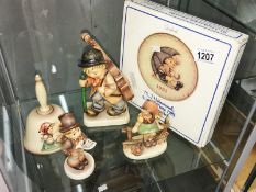 A rare Hummel large cellist (eyes closed), 2 other Hummel figures, a Hummel bell and a Hummel plate.