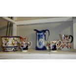 A blue and white jug and 4 others.