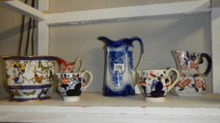 A blue and white jug and 4 others.