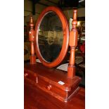 A stained pine toilet mirror with drawer.