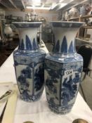 A pair of blue and white Chinese pattern vases.