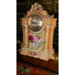 A floral decorated ceramic mantel clock.