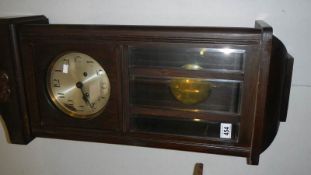 An oak wall clock.