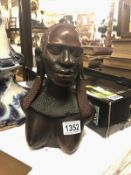 A carved hardwood female bust.