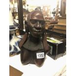 A carved hardwood female bust.