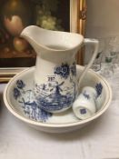 A blue and white jug and basin set.