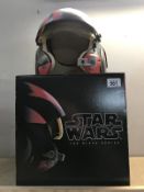 A boxed Star Wars The Black Series Poe Dameron helmet.