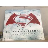 A Batman V Superman advertising poster signed by 8 members of the cast.
