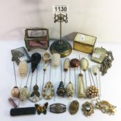 A mixed lot including hat pins, hat pin stand, vesta case on silver watch chain etc.