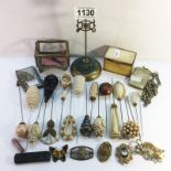 A mixed lot including hat pins, hat pin stand, vesta case on silver watch chain etc.