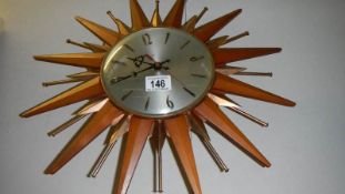 A sunburst wall clock.